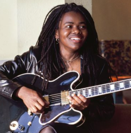 Tracy Chapman, an acclaimed American singer-songwriter, rose to fame with her chart-topping singles "Fast Car" in 1988 and "Give Me One Reason" in 1995. 