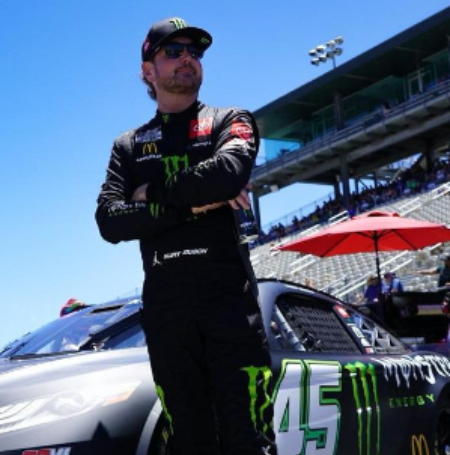 Kurt Busch, an American racer, raced in the NASCAR Cup Series until 2022, driving for 23XI Racing in car No. 45. 