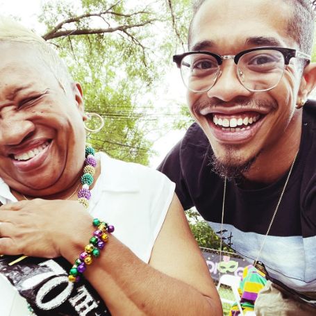 Gary LeRoi Gray posing for a photo shoot with his mother during her 70th birthday. 