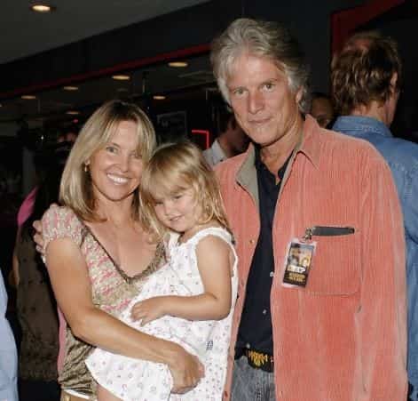 Tracy Kristofferson carrying her daughter, Maggie Lee Tyson.