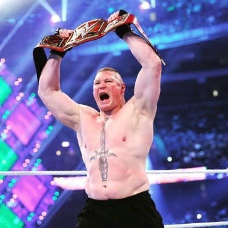 Brock Lesnar holding a WWE belt. 