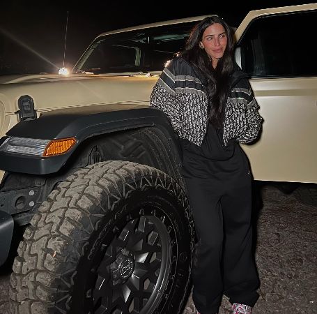 Barbara de Regil posing for a photoshoot in front of her car.