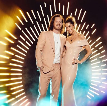 Tyler Hubbard and Hayley Stommel  posing for a photo shoot.