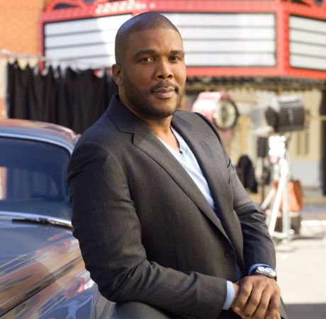 Tyler Perry posing for a photo shoot.