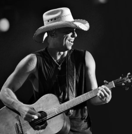 Back in 1992, Kenny Chesney had an audition with Troy Tomlinson of Opryland Music Group, and he left with a contract to write songs. 